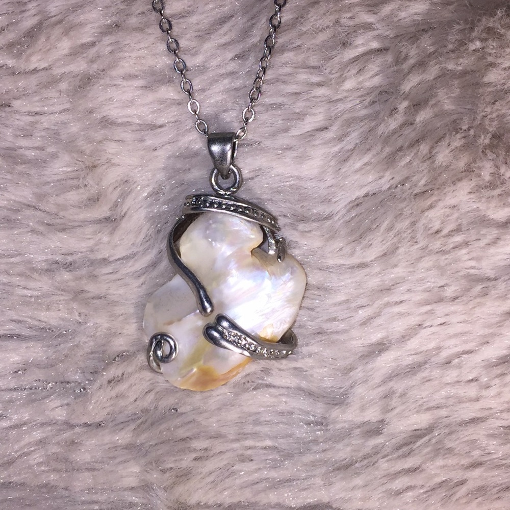 Stone necklace wrapped in silver on a silver chain